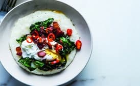 Cheesy Grits With Poached Eggs, Greens, and Bacon
