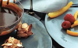 Chocolate Fondue with Candied Orange Peel, Raspberries, and Almond Macaroons