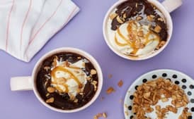 Gooey Chocolate Microwave Mug Cake with Caramel Sauce and Peanuts