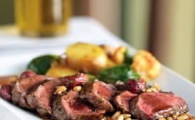 Grilled Lamb with Curried Vegetables and Grape Pine Nut Gremolata