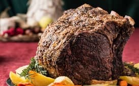 Herb-Crusted Beef Rib Roast with Potatoes, Carrots, and Pinot Noir Jus