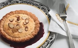 Lemon Soufflé Tartlets with Sugared Almonds and Blackberry Sauce