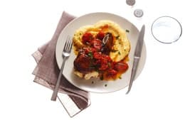 Mozzarella-Stuffed Pork Chops with Polenta and Tomatoes