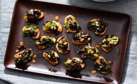 Olive-Oil Toasts With Greens, Pine Nuts, and Raisins