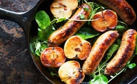 Pan-Seared Sausage With Lady Apples and Watercress