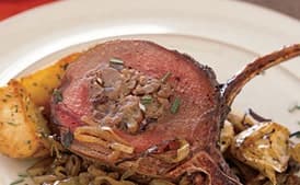 Rack of Venison Stuffed with Pecans, Currants, Sausage, and Pears