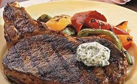 Rib-Eye Steaks with Bell Peppers and Gorgonzola Butter
