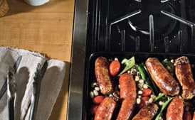 Skillet Sausages with Black-Eyed Peas, Romano Beans, and Tomatoes