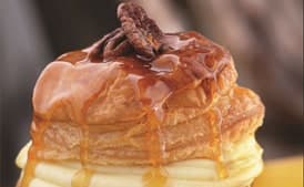 Soufflé of Puff Pastry with Orange-Scented Pastry Cream, Candied Pecans, and Caramel Butter Sauce
