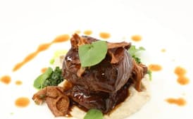 Tamarind-Braised Short Ribs with Truffle Sunchoke Purée, Watercress Purée, and Glazed Chanterelle Mushrooms